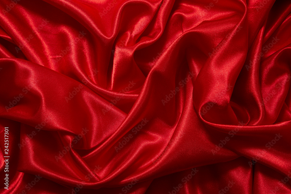 Luxury red satin smooth fabric background for celebration, ceremony, event invitation card or advertising poster Luxury red satin smooth fabric background for celebration, ceremony, event invitation card or advertising poster