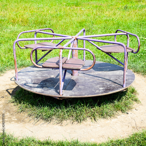 Children's iron carousel. photo
