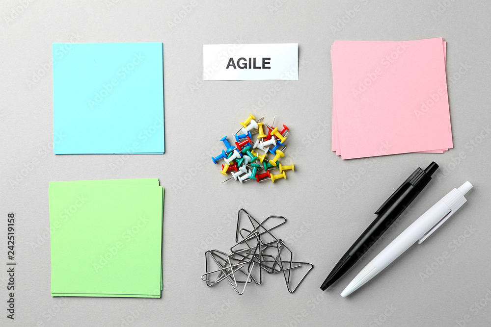 Word AGILE and stationery on light background Word AGILE and stationery on light background