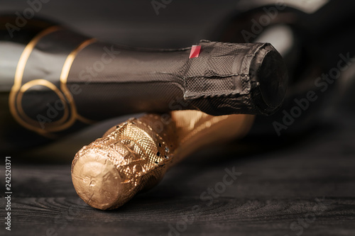 Two champagne bottles on bl...