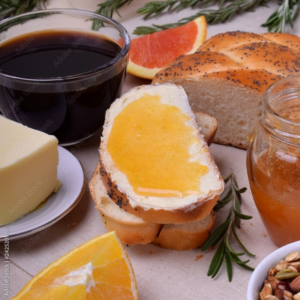 Fototapeta premium Slice of bread with butter and jam. Breakfast food