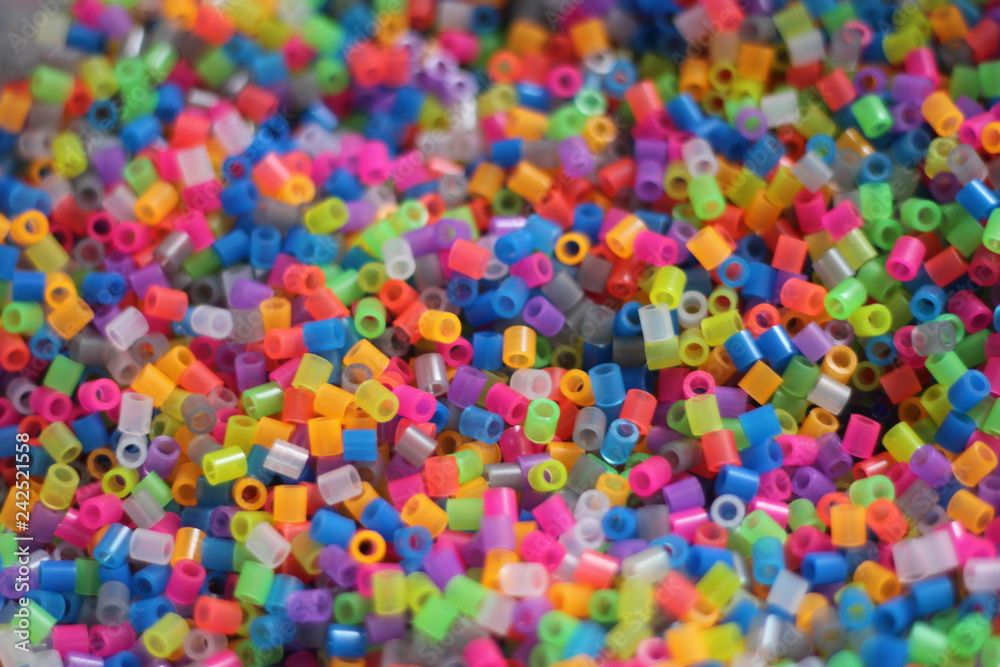 Multicolored background of tubes, cut into small pieces. wandering focus. Multicolored background of tubes, cut into small pieces. wandering focus.