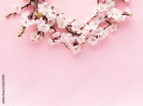 Novruz wreath mock up made of traditional Azerbaijan pastry shekerbura and pakhlava, beautiful tiny blossoms for spring equinox celebration,grey or blue background, flat lay copy space for text