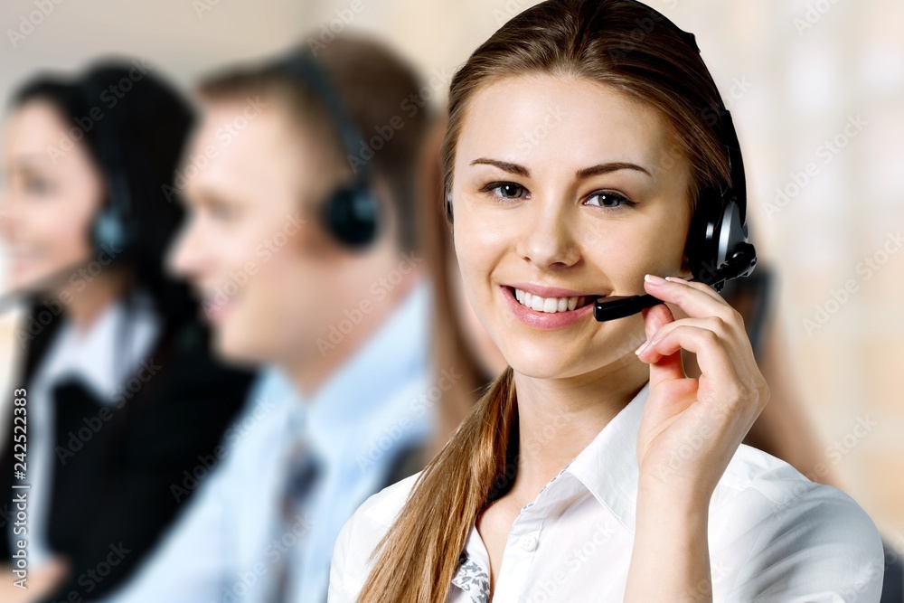 Close-up view of young woman face with headphones, call center Close-up view of young woman face with headphones, call center