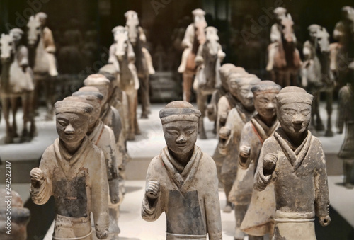 Miniature ancient warriors standing in formation 