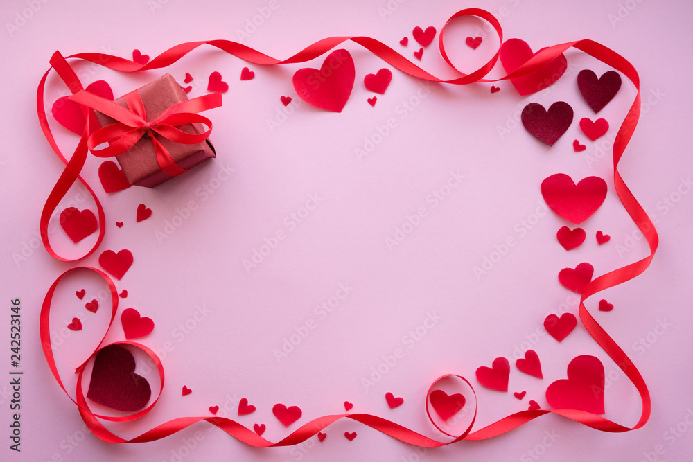 Valentine's day frame on rose background with hearts and ribbon. Copy space Valentine's day frame on rose background with hearts and ribbon. Copy space