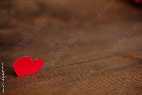 Red heart on a blue wooden board. Copy space