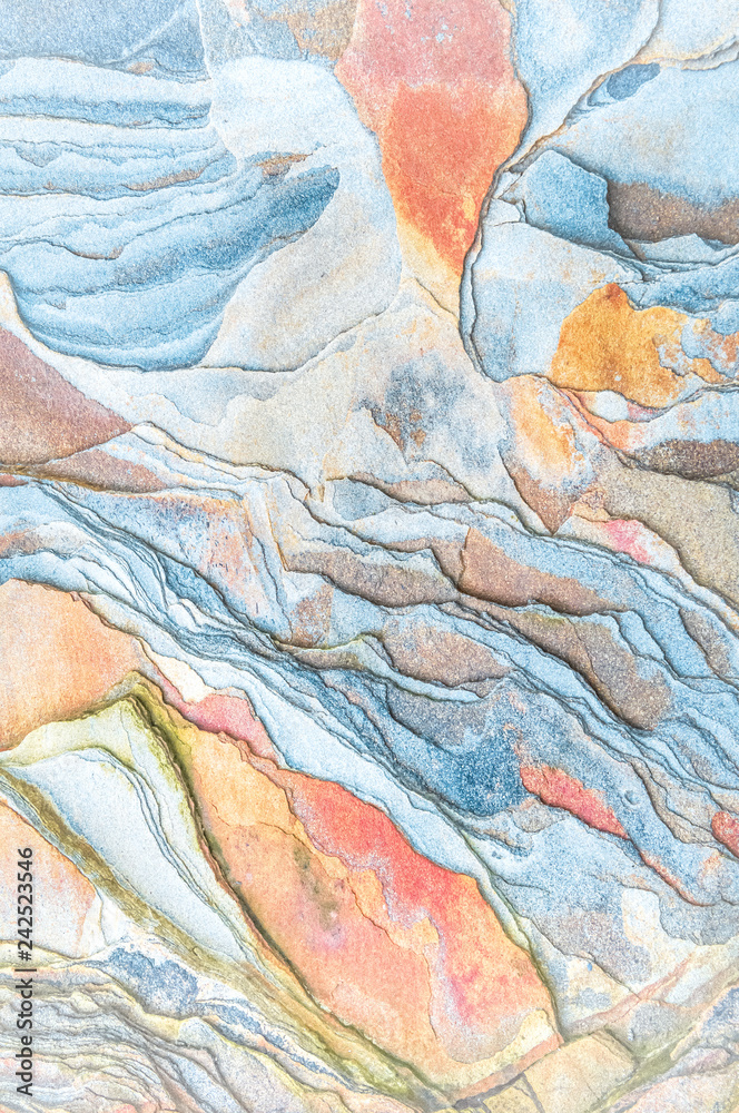 Fototapeta premium Rock layers - a colorful formations of rocks stacked over the hundreds of years. Interesting background with fascinating texture