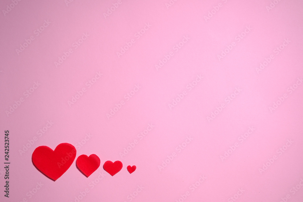 Red Hearts on pink background with copy space