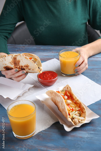 Woman eating delicious chic...