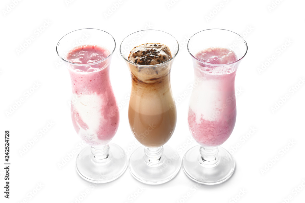 Glasses of tasty milkshakes on white background Glasses of tasty milkshakes on white background
