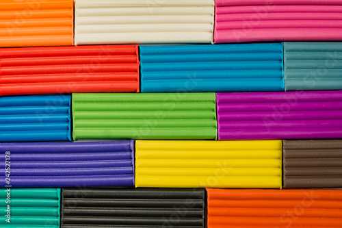 Rainbow colors of modeling clay. Multicolored plasticine bars background.