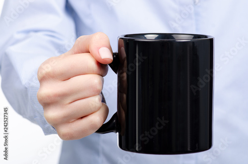 Woman in hand black cup mug on white background