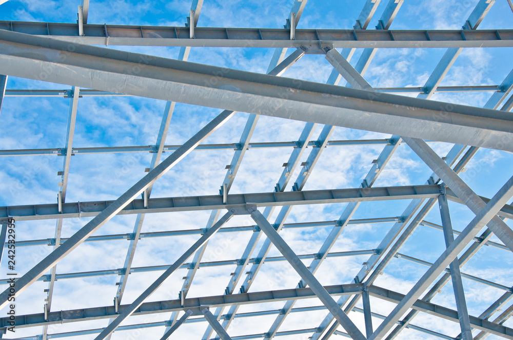 Structure of building. Steel construction on sky background Structure of building. Steel construction on sky background