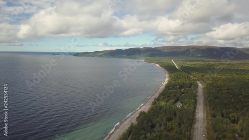 Aerial view of a beautiful beach on the Great Lakes of North America, Lake Superior, during a vibrant sunny day. Taken in Agawa Bay, Ontario, Canada. photo