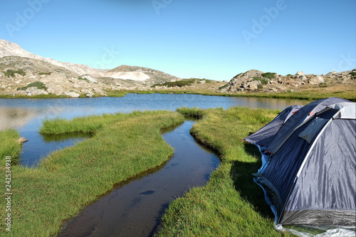 Camping tents on an grassy island at a (Sakligol) Lake, Bursa photo
