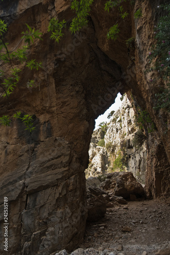 Rock arch on trekking trail at Imbros gorge near Chora Sfakion, island of Crete, Greece