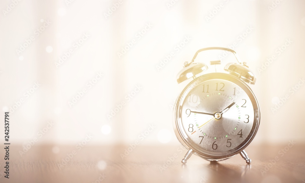 Retro alarm clock on table background Retro alarm clock on table background