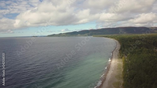 Aerial view of a beautiful beach on the Great Lakes of North America, Lake Superior, during a vibrant sunny day. Taken in Agawa Bay, Ontario, Canada. photo