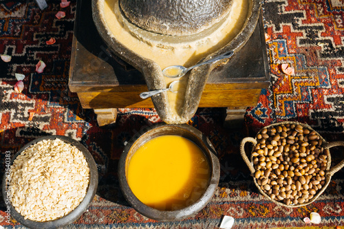 ARGAN OIL. Making of argan oil from argan nuts and seeds in Morocco photo