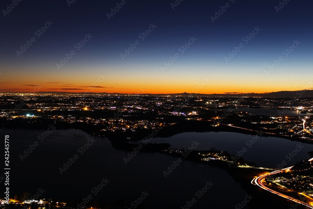 Night view panorama at sunset over northern Lombardy from the Alps