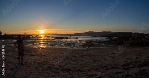 Preciosa puesta de sol en la playa de Espiñeiro en la Isla de Arousa, Galicia, verano de 2018 photo