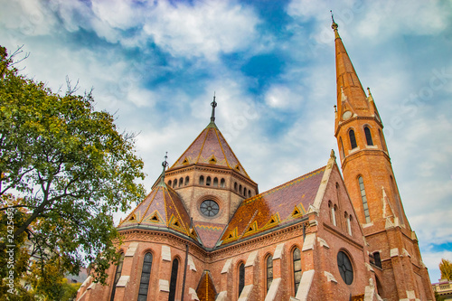 St. Matthias Church in Budapest. One of the main temple in Hungary. There is beautiful cloudy blue sky in the background photo