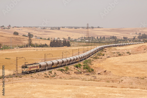 Freight train snaking through the hills photo