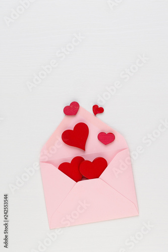 Valentine's Day background.  Letter on white background. Valentines day concept. Flat lay, top view, copy space. © gitusik