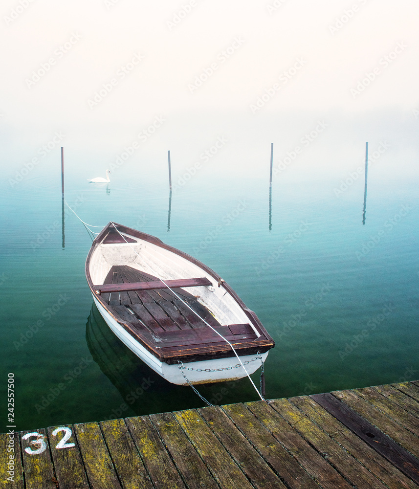 Boat on lake on a foggy day