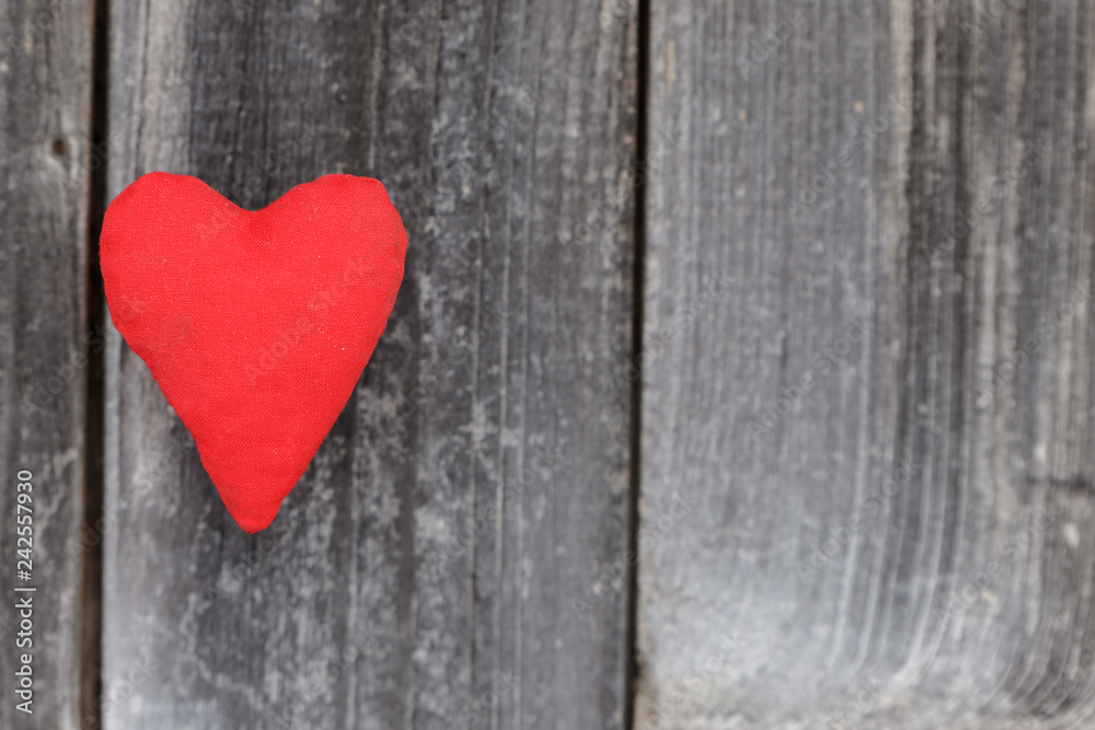 Valentine day, red handmade heart on grey wood background.Valentine's Day card.