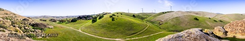 Panoramic view of hills and valleys in the hills of east San Francisco bay area; wind turbines in the background, Contra Costa county, California