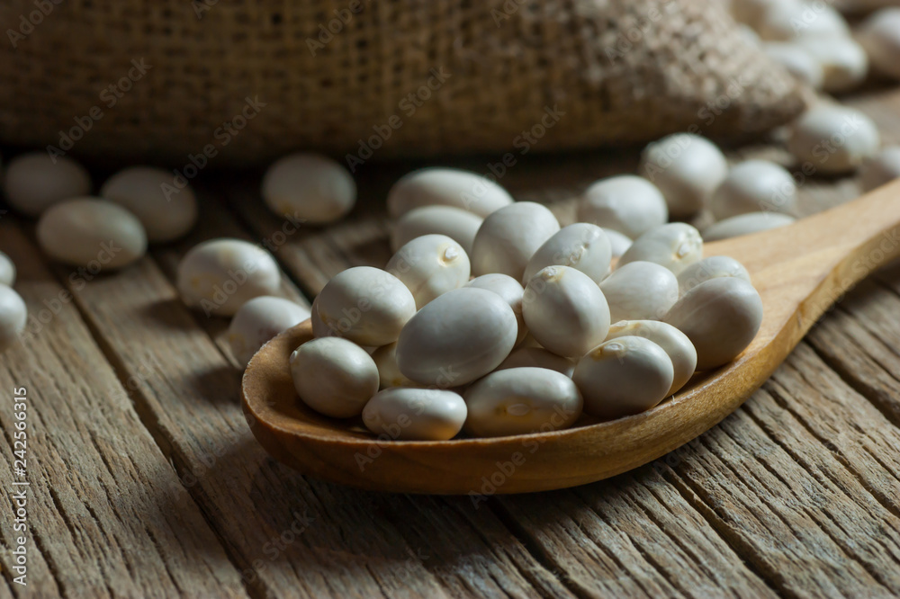 White dried haricot kidney beans on wooden table , heap of legume bean concept. Legumes background
White dried haricot kidney beans on wooden table , heap of legume bean concept. Legumes background