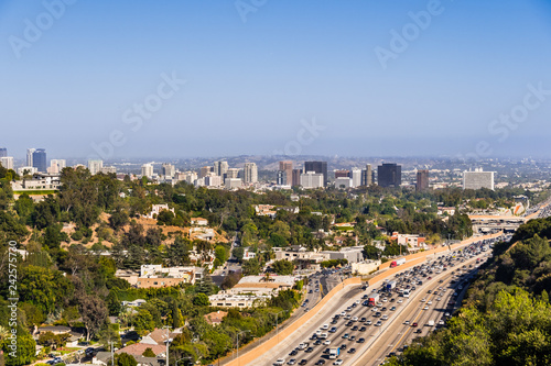 Aerial view towards the skyline of Westwood neighborhood; highway 405 with heavy traffic in the foreground; Los Angeles, California photo