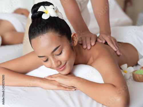 Asian woman are relaxing shoulder massage in the Spa Salon. Thai massage for health.