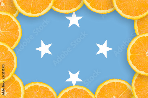 Micronesia flag  in fresh citrus fruit slices frame photo