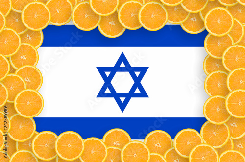 Israel flag  in fresh citrus fruit slices frame photo