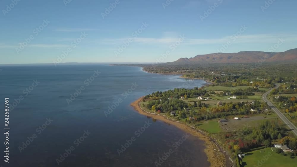 Aerial view of the Atlantic Ocean Coast during a sunny morning. Taken near Gesgapegiag, Quebec, Canada. Aerial view of the Atlantic Ocean Coast during a sunny morning. Taken near Gesgapegiag, Quebec, Canada.