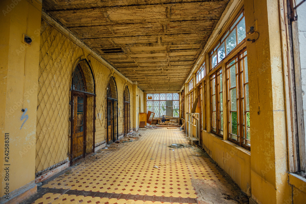 Abandoned mansion interior. Building terrace with tiled floor 