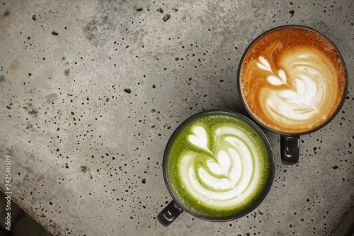 Obraz na płótnie A cup of green tea matcha latte and cup of latte art coffee for background