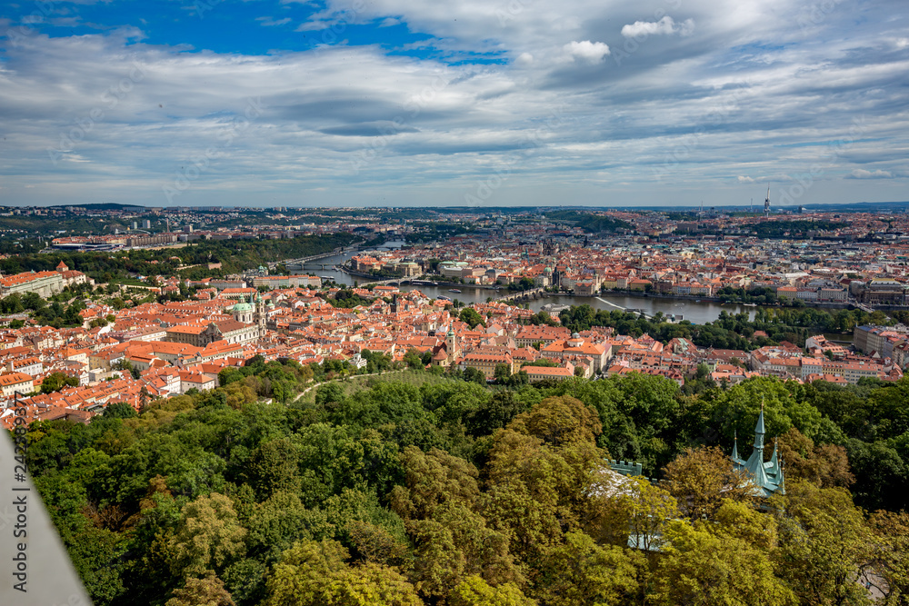 Prague Lesser Town cityscape skyline high angle view as seen as descending from the magnificent Petrin observation and lookout tower across Vltava river in the Czech Republic capital city
