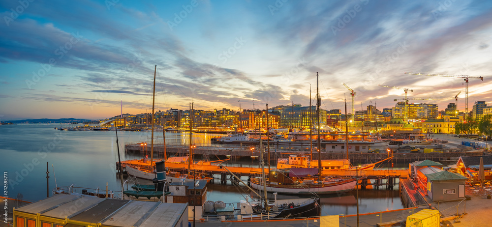 Oslo cityscape at night with view of Port in Oslo city, Norway