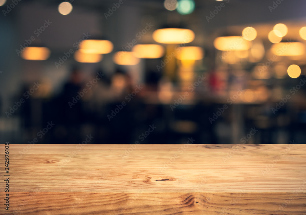 Wood texture table top (counter bar) with blur light gold bokeh in cafe,restaurant background.For montage product display or design key visual Wood texture table top (counter bar) with blur light gold bokeh in cafe,restaurant background.For montage product display or design key visual