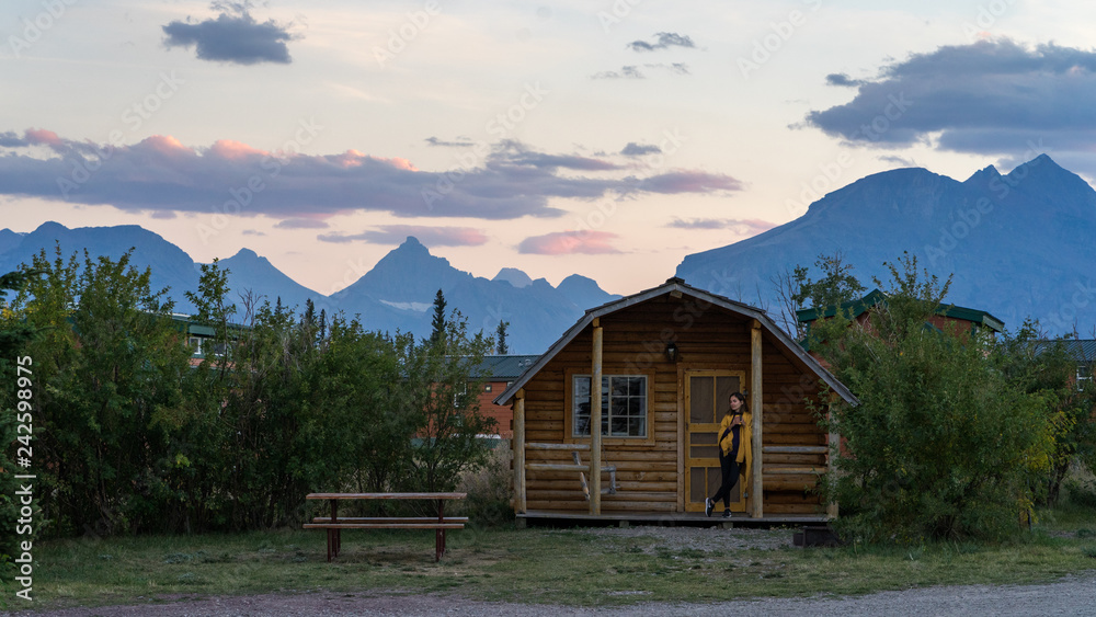 Girl enjoying sunset at the cabin in Glacier National Park Girl enjoying sunset at the cabin in Glacier National Park