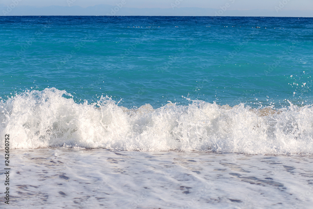 The wave fights about the coast. A surf on the Mediterranean Sea. A beautiful sea landscape on the coast of Turkey