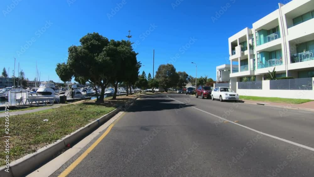 Vehicle POV driving past the Marina in Glenelg, seaside suburb of Adelaide South Australia. Vehicle POV driving past the Marina in Glenelg, seaside suburb of Adelaide South Australia.