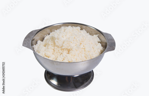 White stream thai jusmine rice in big stainless bowl in restaurent white background clipping path