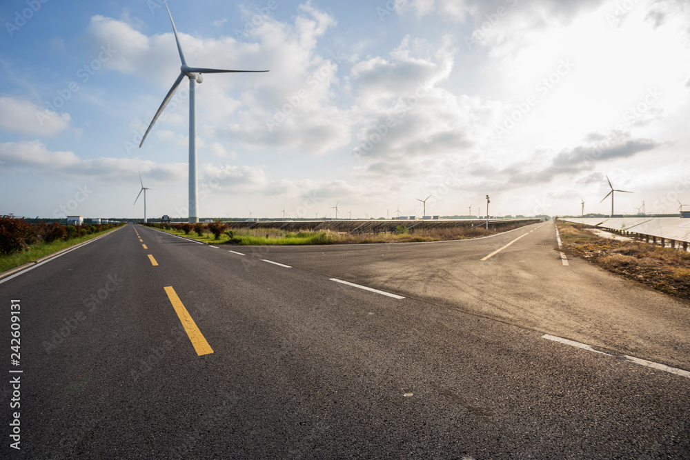 Fototapeta premium Solar panels and wind power, clean energy in nature.