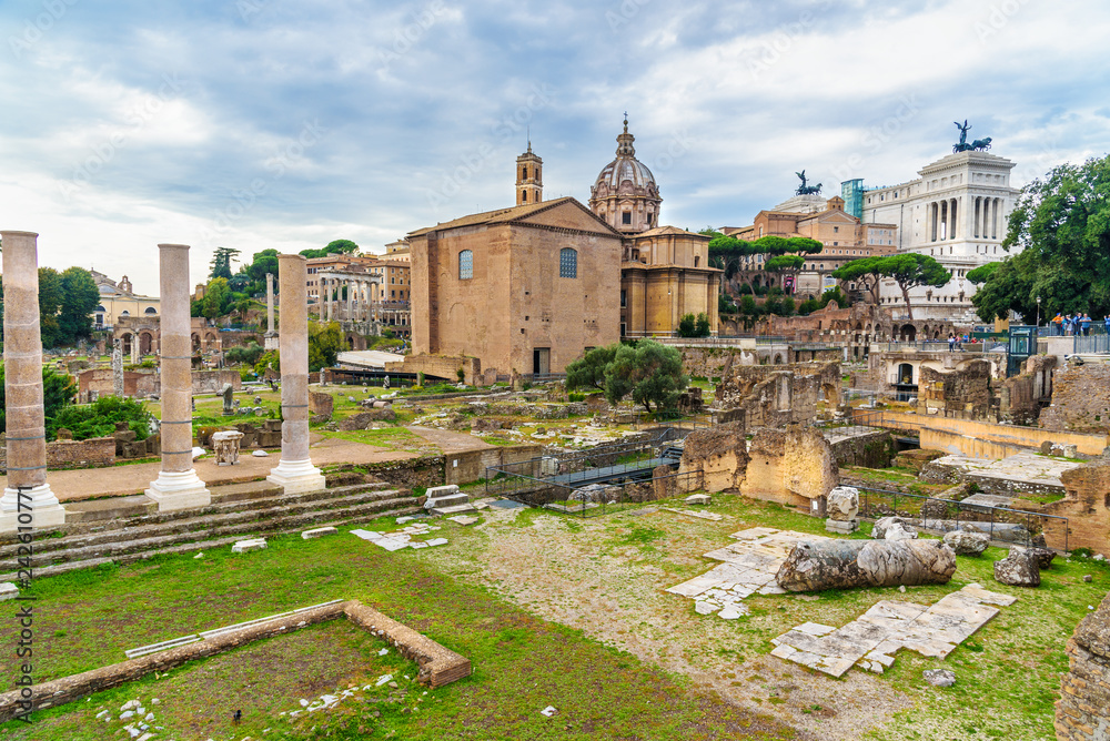 Ruins of Roman Forum. Curia Julia, Roman columns and church of Santi Luca e Martina. Rome. Italy