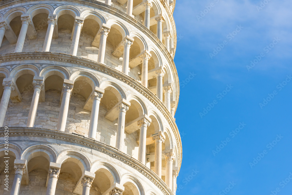 The Leaning Tower of Pisa, Italy, detailed view from close up, arches and columns.